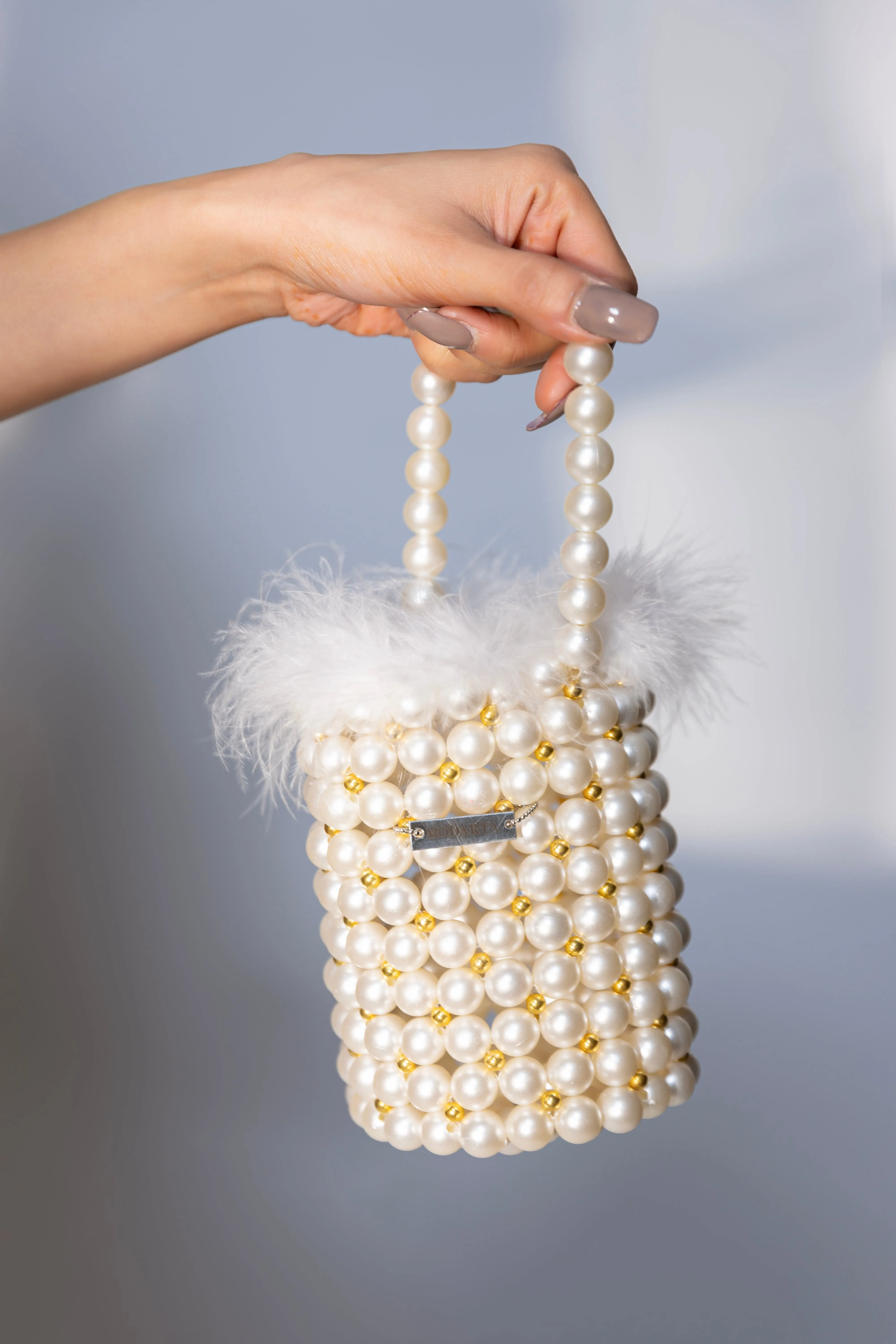 Pearl bag with fur detailing, ideal party wear purse